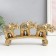 Polystone souvenir "Three gold elephants on the arc - Circus Popon" 15.5x5x28 cm