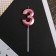 Candle for the cake, the number "3", pink.