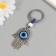 Keychain from the evil eye metal "Fatima hand" 4x8.2 cm