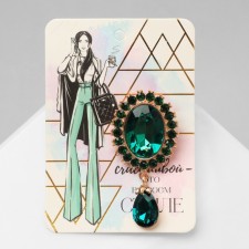 Obval brooch with a drop, green color in gold