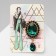 Obval brooch with a drop, green color in gold