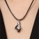Kulons "Uzolnutinok" on the magnet, handshake, black-silver color, 52 cm
