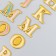 Plastic sticker "English alphabet and numbers. Gold stroke" 31x14 cm