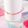Antistress Assortment Bracelet Unicorn, red color in gold, d = 6 cm