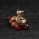 Souvenir "Snake of Cobra", small, brass, amber