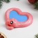 New Year. Symbol 2025. Figure soap "Snake Heart" pink with blue