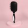 The comb is massage, wide, with a mirror, 8.3 × 24 cm, black/white color