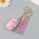 A keychain plastic, rubber with a carbine, a rosel strap of pink 3x3.5x5 cm