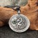 Amulet "Dragon" with a jadet stone, 35x42 mm, metal