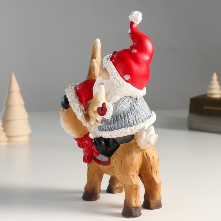 Suvenir Polystone "Santa Claus riding Oleska in a red cap and scarf" 8x14x23 cm-1