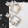 Earrings with rhinestones "flutter" butterflies in a square, white color in gold