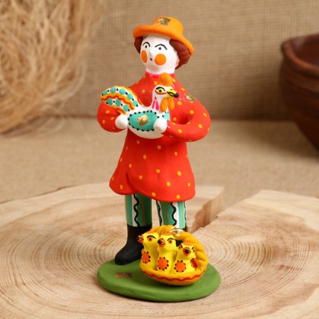 Dymkovo toy "Standing man with a chicken"-1
