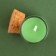 New Year's candle in the spruce cones flask