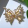 Brooch "Butterfly" mother of pearl, colored in gold