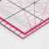 A quilting and patchwork ruler, 45 × 10 cm, thickness 3 mm, transparent/pink color