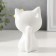 Souvenir Ceramics "White cat with yellow flowers on the ear, sits" 7.2x6.5x10.3 cm