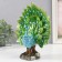 Polystone souvenir "Blue peacock with green blossomed tail in the meadow" 10.5x22x26 cm