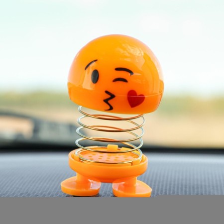 Smile on the spring, on the panel in the car, heart, yellow