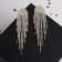 Hanging earrings with “comet” rhinestones, white color in gold, 8.5 cm