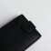 Men's purse on the button, a department for cards, coins, black color