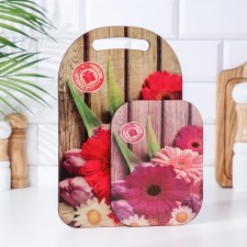 Set of wooden cutting board and a hot stand with decor 