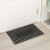 Rug of harassed cellular shares, 39.5 × 59 cm, black color
