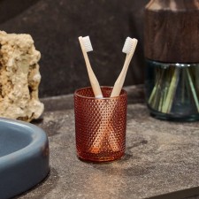 A glass for dental brushes, 8x8x10 cm, color orange color