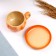 A cup with a saucer, orange, 0.2l