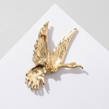 Brooch "Bird" in flight, black color in gold-1