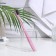 The toothbrush is soft, in the tube, pink