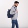 A backpack with a zipper, "saxi", outer pocket, blue color