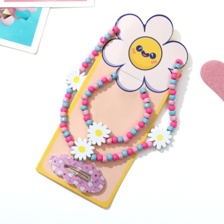 Set of children's "chosen" 3 objects: hairpin, beads, bracelet, chamomile flowers, colored