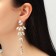 Hanging earrings with rhinestones "bun" deciduous, white color in gold, 9.5 cm
