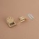 Bag's fastener, 2.3 × 3.5 cm, gold color