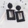 Caribbean metal earrings are large, black color