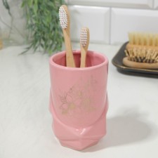 A glass for toothbrushes 