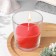 A candle in a smooth glass flavored "flowering garden", 8.5 cm