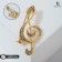 Brooch "Violin key" radiance, white color in gold
