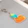 Acryl keychain "Snakes with the Globe" 5.8x5 cm
