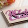 Wooden envelope carved "wish happiness" white background