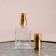 Perfume bottle, with a spray, 15 ml, golden color