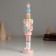 Polystone souvenir "Nutcracker in a pink uniform, with a gift" 4.5x4.5x21 cm