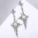 Earrings under the natural stone "Stars" are four -pointed with stone, blue color in silver