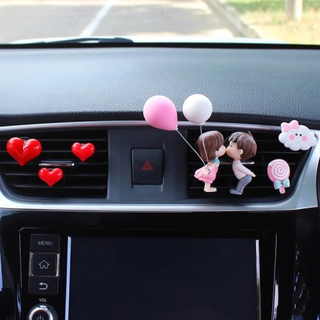 A toy in a car deflector, a couple in love, K6