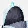 A backpack with a zipper, 3 outer pockets, green color