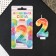 A candle for a cake, a number with color application of 2 "Happy Birthday".