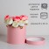 The hat box is gently pink, 23 x 23 cm