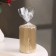 Candle-cylinder with faces, 5x7.5 cm, gold, 6 hours
