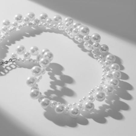 The necklace is "pearl" ornament, beads No. 4, 6, 8, white color in silver, 38 cm