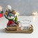 Polystone candlestick "Olennian in a blue hat on a sled with a Christmas tree" 15x6.7x12.5 cm